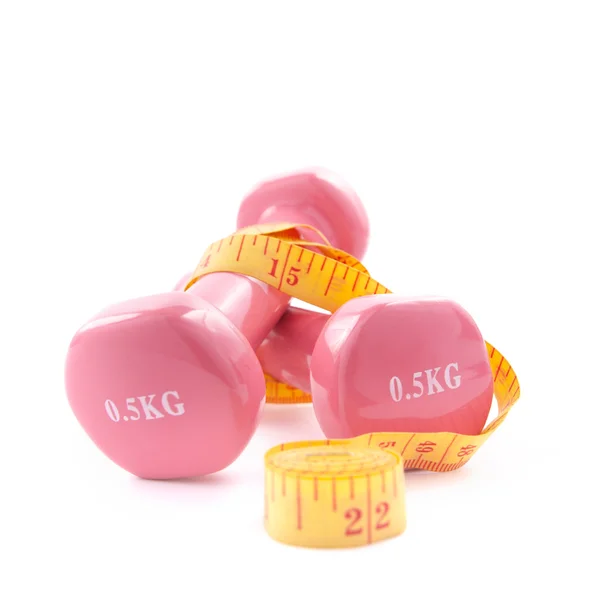 Pink dumbbells tied with a measuring tape. — Stock Photo, Image