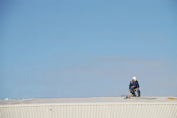 stock image Man Working on Roof