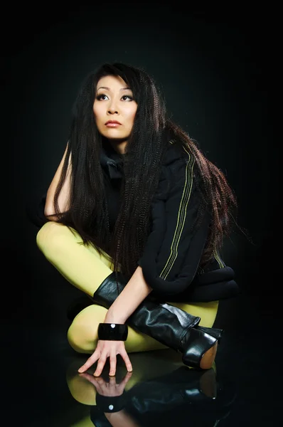 Sitting brunette asian model — Stock Photo, Image