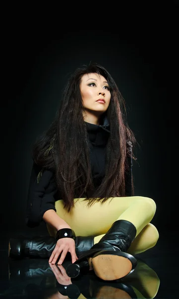 Sitting brunette asian model — Stock Photo, Image