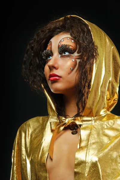 Girl in gold hood mante — Stock Photo, Image