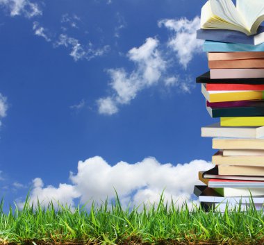 Stack of books in the garden clipart