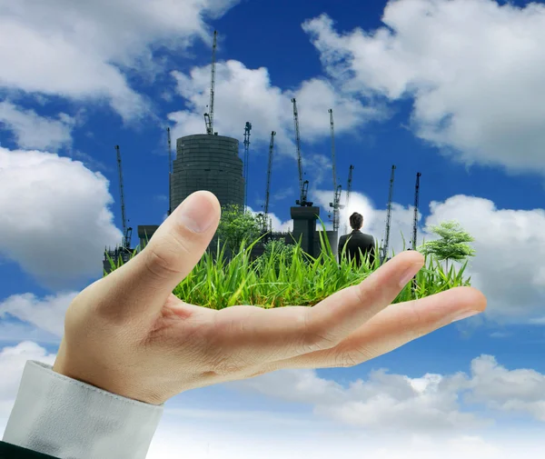 Building in hands — Stock Photo, Image
