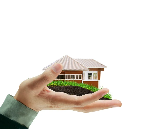 Huis in menselijke handen — Stockfoto