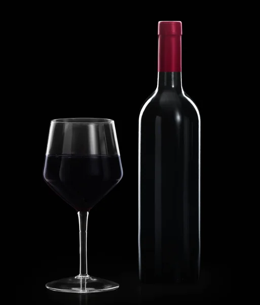 Ποτήρι κόκκινο κρασί και ένα μπουκάλι — Φωτογραφία Αρχείου