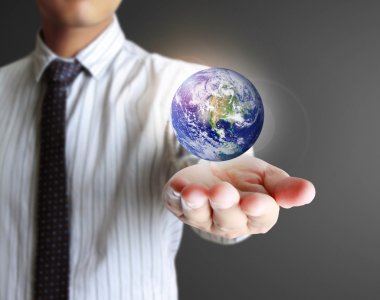 Globe in his hands . Earth image provided by NASA. clipart