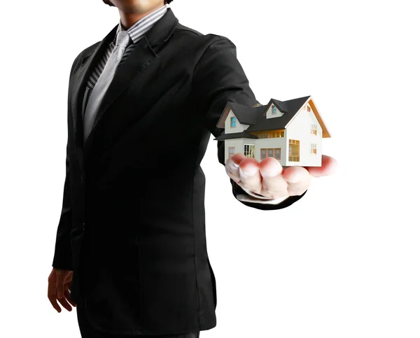 Huis in mens een handen — Stockfoto