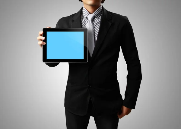 stock image Businessman hands are holding the touch screen device,tablet