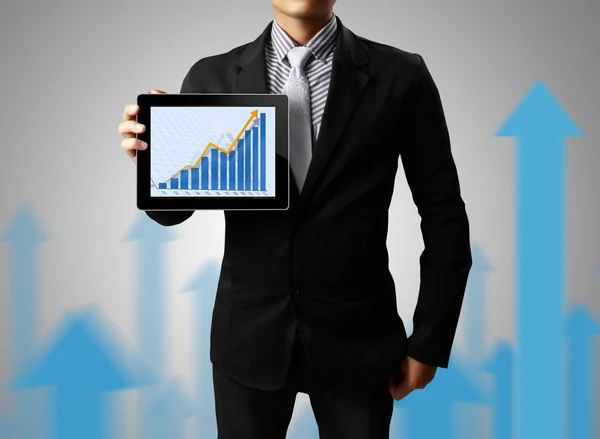 Hand pointing on touch screen graph on a tablet — Stock Photo, Image