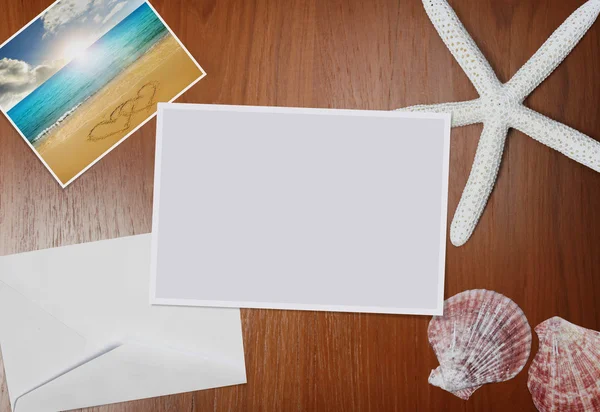 Paper and Shells on wood — Stock Photo, Image