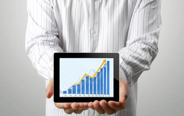 Businessmen and ,graph on a tablet — Stock Photo, Image