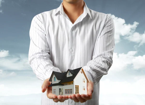 Stock image House in hands