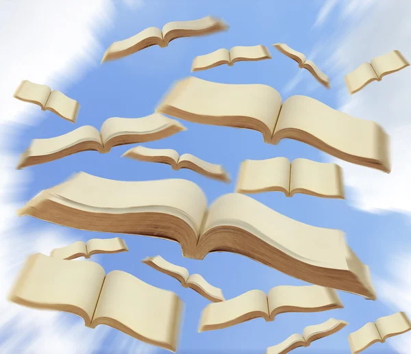 Книги летять у небо — стокове фото
