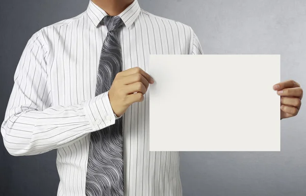 Business man handing a blank card over — Stock Photo, Image