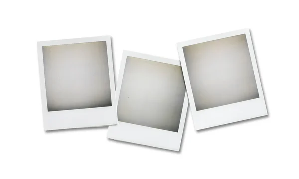 Three blank polaroid pictures overhead isolated on white with cl — Stock Photo, Image