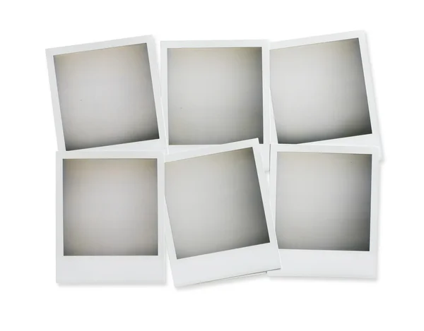 六个空白宝丽来照片上白色带剪辑孤立的开销 图库照片
