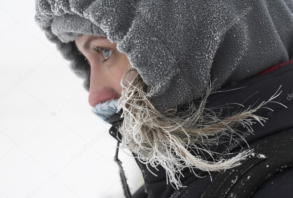 Girl looks away at cold winter day