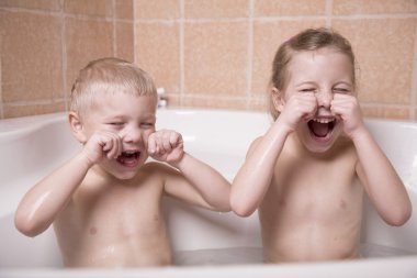 Two children play in bathroom clipart