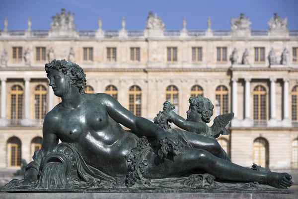 stock image A statue in garden of Versailles, the famous palace of the Sun King: Louis XIV
