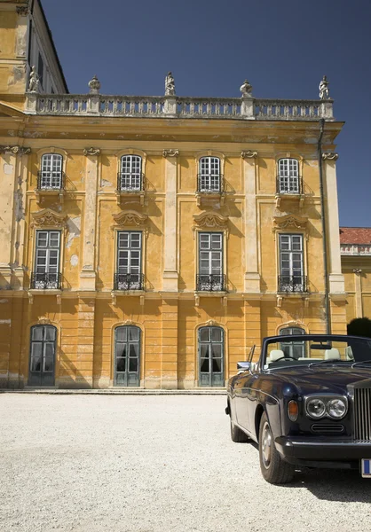 stock image Luxury car stands in ruined castle garden