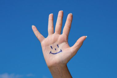 Human palm with smile clipart