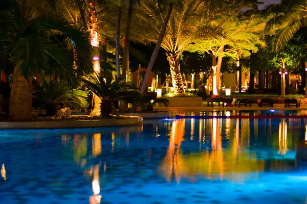 Luxury resort with pool at night view — Stock Photo, Image