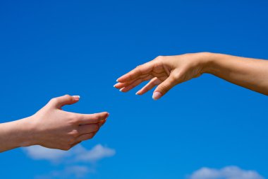 Hand reaching out from the sky clipart