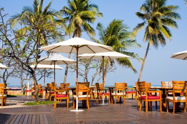 Table setting at beach restaurant clipart