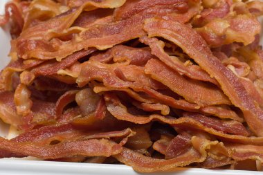 Slices of fried bacon clipart