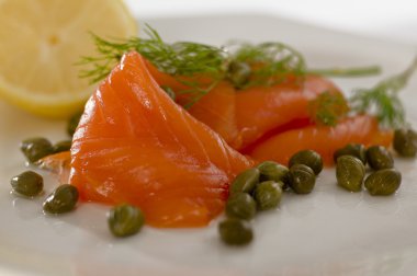 Salmon with dill,capers and lemon clipart