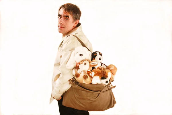 A man with a bag of many toys — Stock Photo, Image