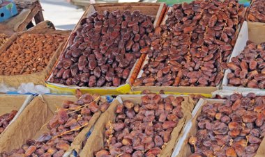 Dates (date fruits) on display in the street market clipart