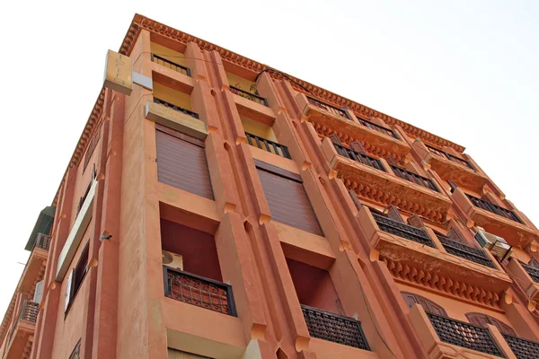 stock image Beautiful modern red building in the street of Marrakesh