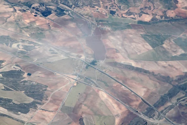 Weergave van de aarde vanuit een vliegtuig venster Stockfoto