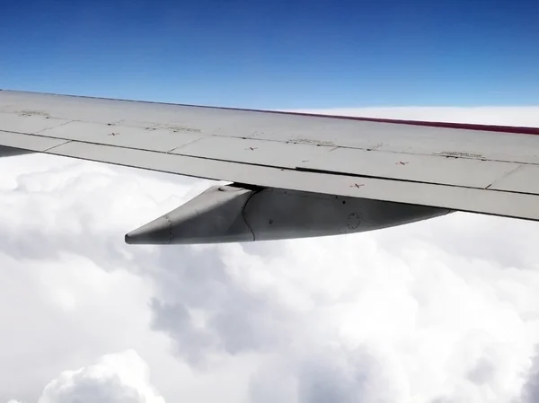 Aerial view of jet plane wing and clouds — Stock Photo, Image