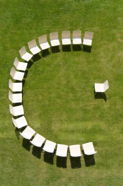 Lecture symbolized by chairs arranged in a half circle clipart