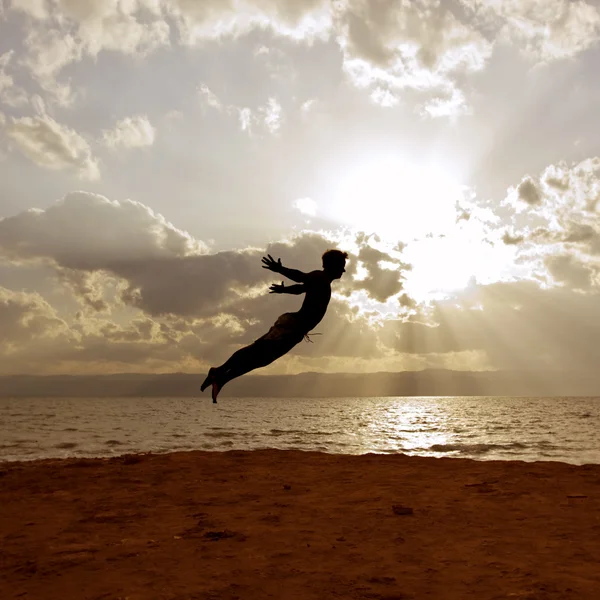 One person acrobatic jumping scene symbolize vitality, aspiration, success, progress — Stock Photo, Image