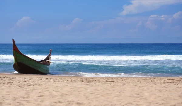 stock image The lonely boat on an ocean coast