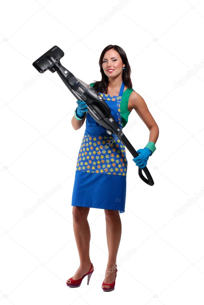 Beautiful housewife with the vacuum cleaner