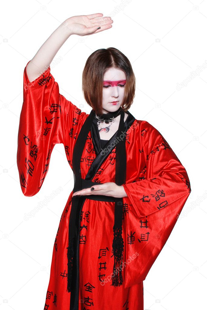 Beautiful young geisha girl in kimono with sword