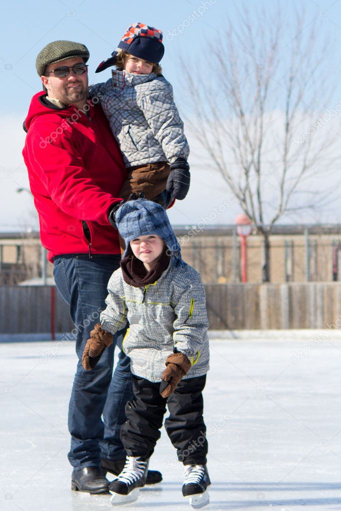 Happy family at the skating rink