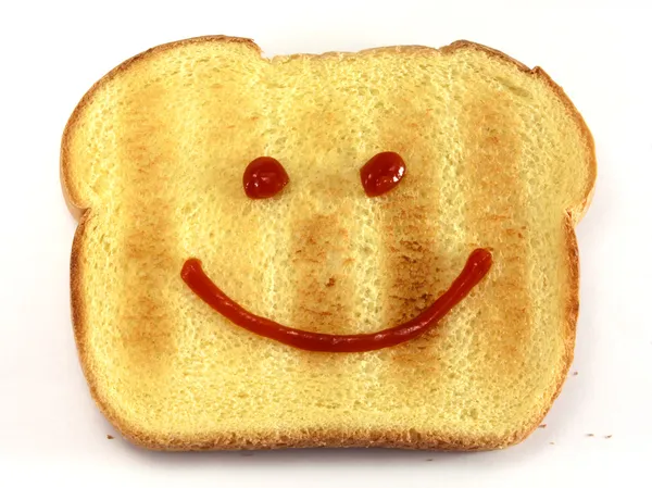 Хлеб со счастливым лицом — стоковое фото