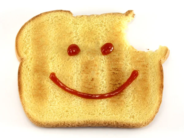 Chléb s šťastný obličej a kousnutí — Stock fotografie