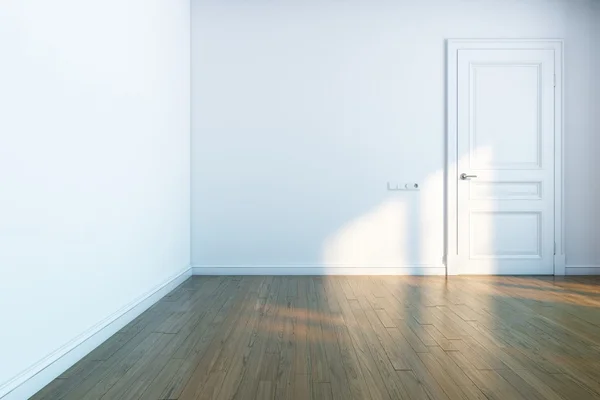 Белая комната с деревянным паркетом и белой дверью — стоковое фото