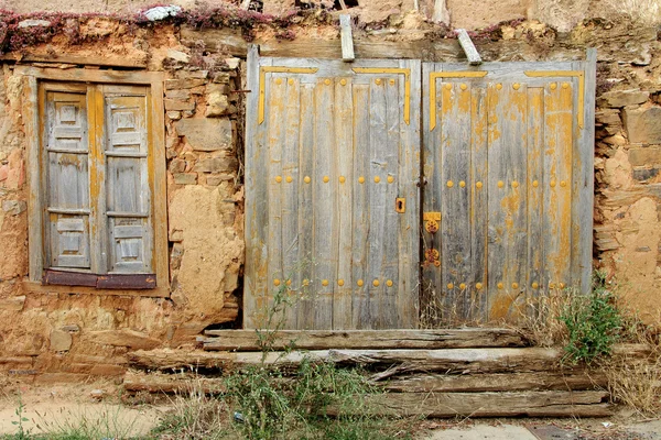 Old rusty wooden door and window — Stock Photo, Image