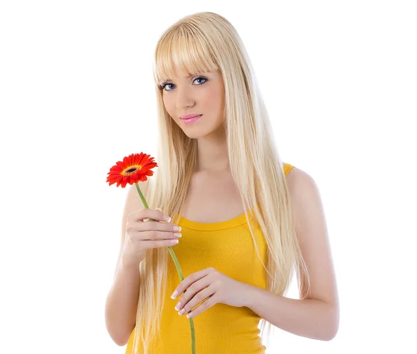 Woman smiling while holding flower — Stock Photo, Image
