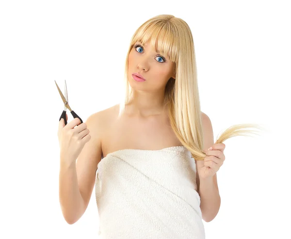 Woman with scissors looking surprised — Stock Photo, Image