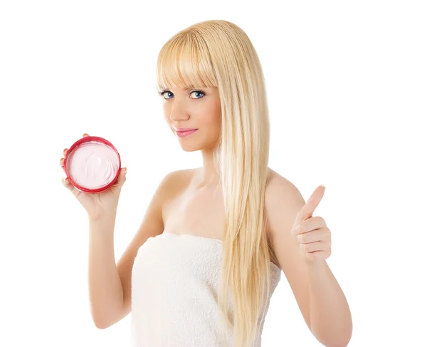 Young smiling woman with cream giving thumbs up — Stock Photo, Image
