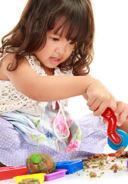 Little girl with her clay — Stock Photo, Image