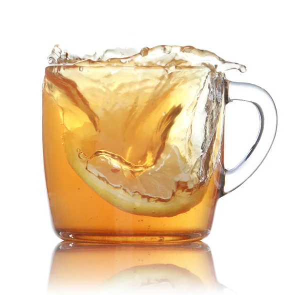 Lemon slice falling in to glass with ice tea — Stock Photo, Image